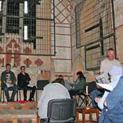 St Denis' church East Hatley, Cambridgeshire – the Taizé service on 7th September 2011. The candle lit event was led by Ian parker (standing) and was the first service to be held in St Denis, East Hatley, since the church was closed in 1959. Among the 18 worshippers was The Reverend Steven Rothwell (back row, right), then the vicar of St Mary's Gamlingay. St Denis' wonderful acoustic was rediscovered during the service.