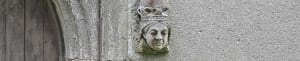 A stone head of Queen Victoria carved as a stop at the base of the south door arch at Hatley St George church, Hatley St George, Cambridgeshire.
