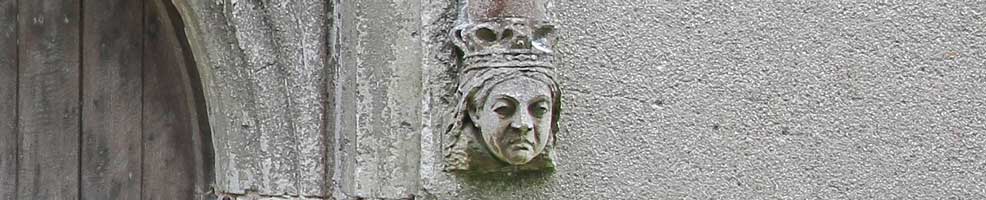 A stone head of Queen Victoria carved as a stop at the base of the south door arch at Hatley St George church, Hatley St George, Cambridgeshire.